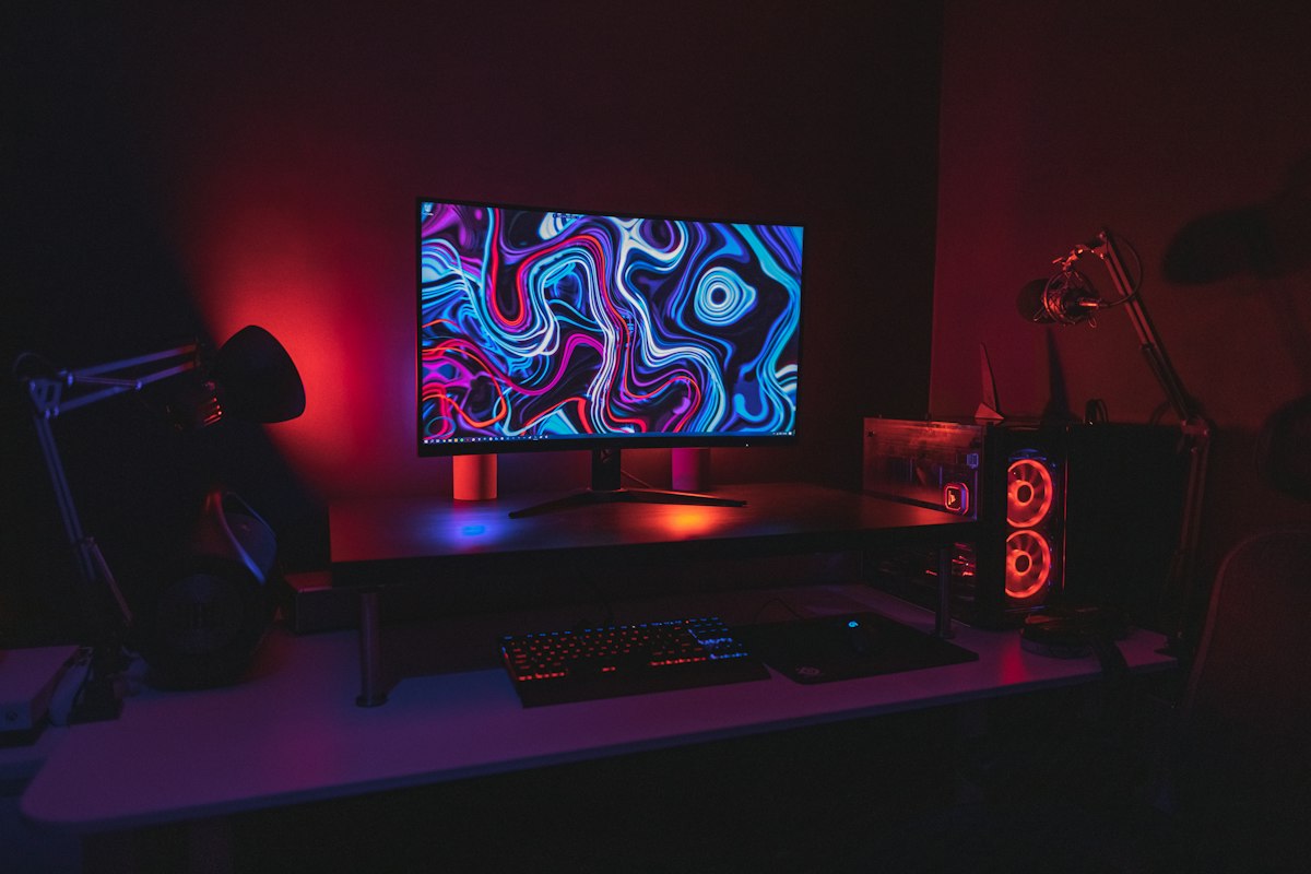 Curved ultrawide monitor gaming battlestation with dynamic ambient backlighting