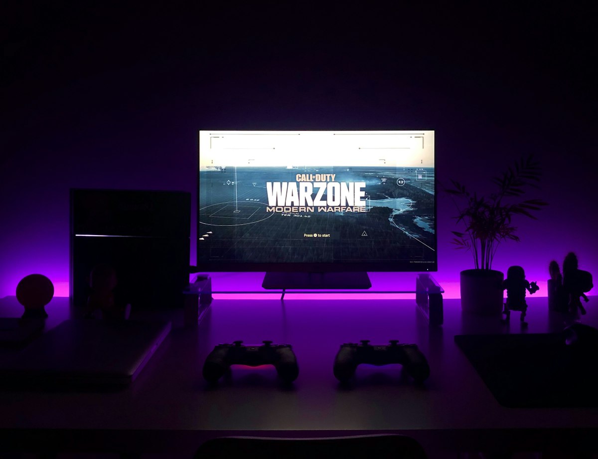 Gamer enjoying console shooter in a modern living room setting
